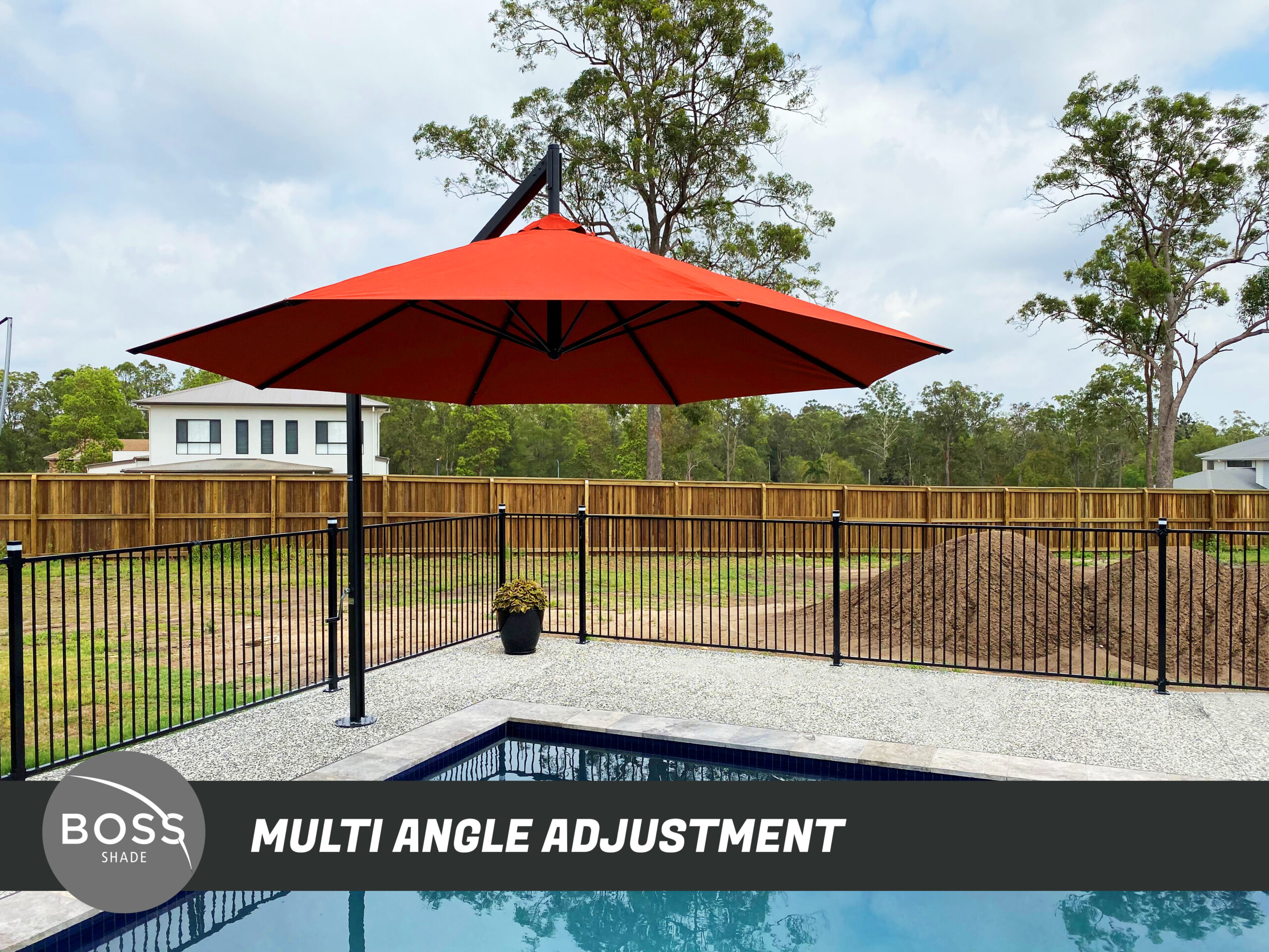 Outdoor cantilever umbrella with adjustable arm over a lounge area. Outdoor cantilever umbrella with adjustable arm over a lounge area.
